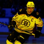 Boston Bruins center Patrice Bergeron (37) skates prior to the first period of an NHL hockey game against the Buffalo Sabres, Sunday, March 19, 2023, in Buffalo, N.Y.