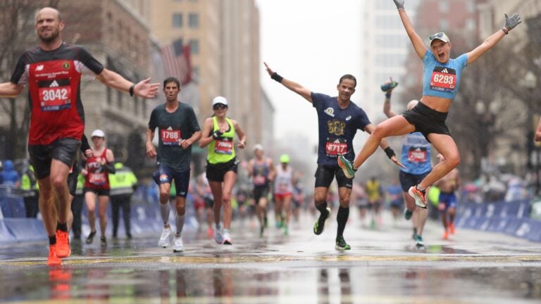 Brooke Lorentz celebrates after crossing the finish line during the 127th Boston Marathon on April 17, 2023 in Boston, Massachusetts.