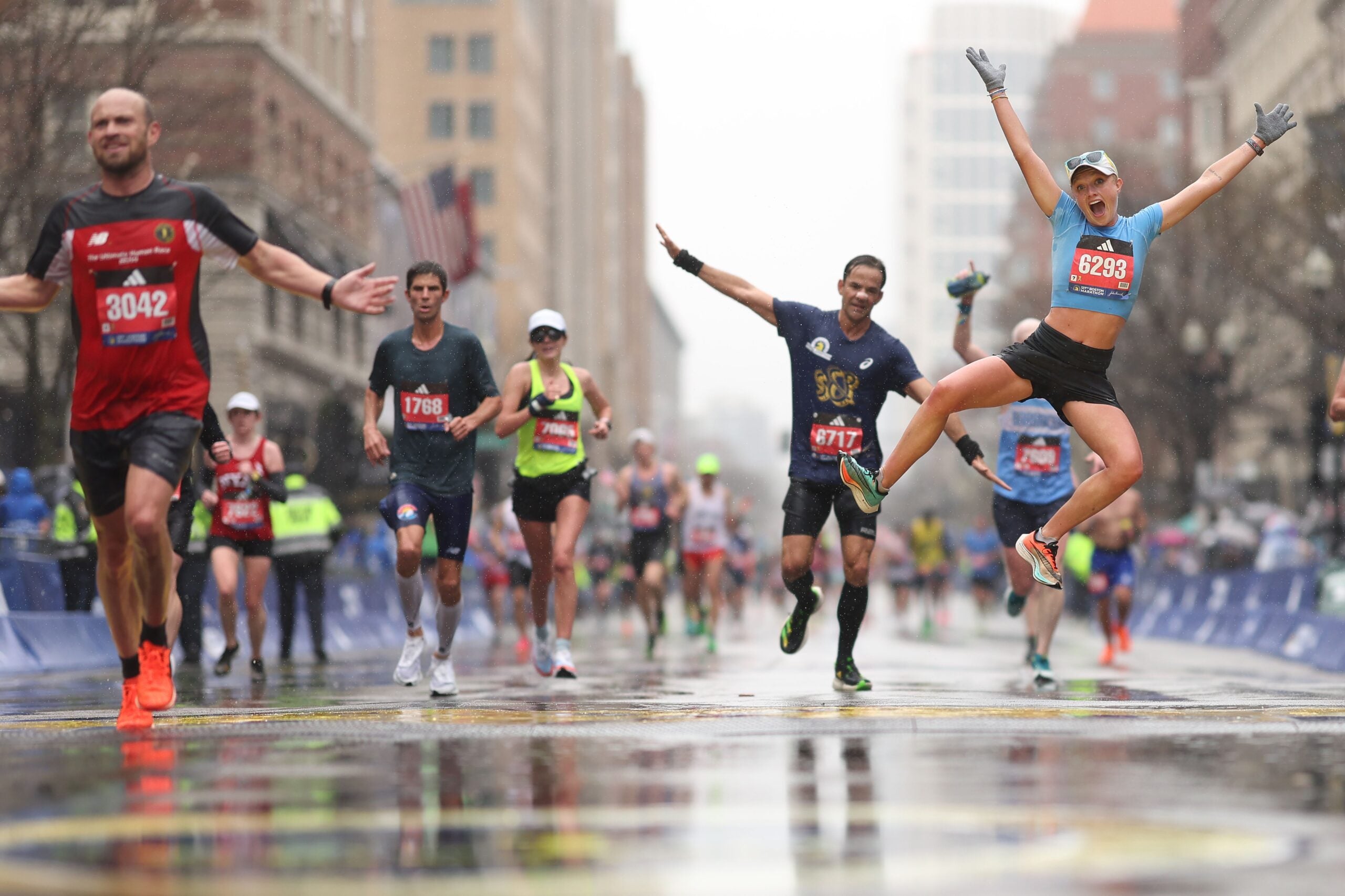 Brooke Lorentz celebrates after crossing the finish line during the 127th Boston Marathon on April 17, 2023 in Boston, Massachusetts. 