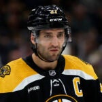 Boston Bruins' Patrice Bergeron during the third period of an NHL hockey game against the Vancouver Canucks Sunday, Nov. 13, 2022, in Boston.