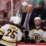 Head coach Jim Montgomery talks to Brandon Carlo #25 of the Boston Bruins during a break in action during the game against the Florida Panthers in Game Six of the First Round of the 2023 Stanley Cup Playoffs at the FLA Live Arena on April 28, 2023 in Sunrise, Florida.