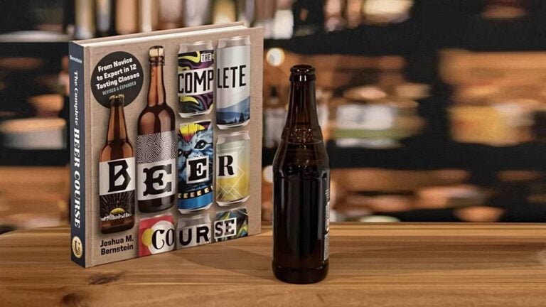 Complete Beer Course book on a bartop with a bottle of beer
