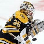 Boston Bruins' Linus Ullmark blocks a shot during the third period of an NHL hockey game against the New Jersey Devils, Saturday, April 8, 2023, in Boston.