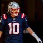 Gronkowski - Patriots quarterback Mac Jones takes the field