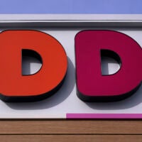 The "D D" sign is seen on the front of a Dunkin' Donuts coffee store, Monday, Feb. 27, 2023, in Methuen, Mass.