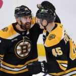 01-22-23: Boston, MA: After the Bruins Nick Foligno (left) scored in the second period, he celebrated with teammate Joona Koppanen (right). The Boston Bruins hosted the San Jose Sharks in a regular season NHL hockey game at the TD Garden.