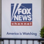 A logo of Fox News is displayed outside Fox News Headquarters in New York.