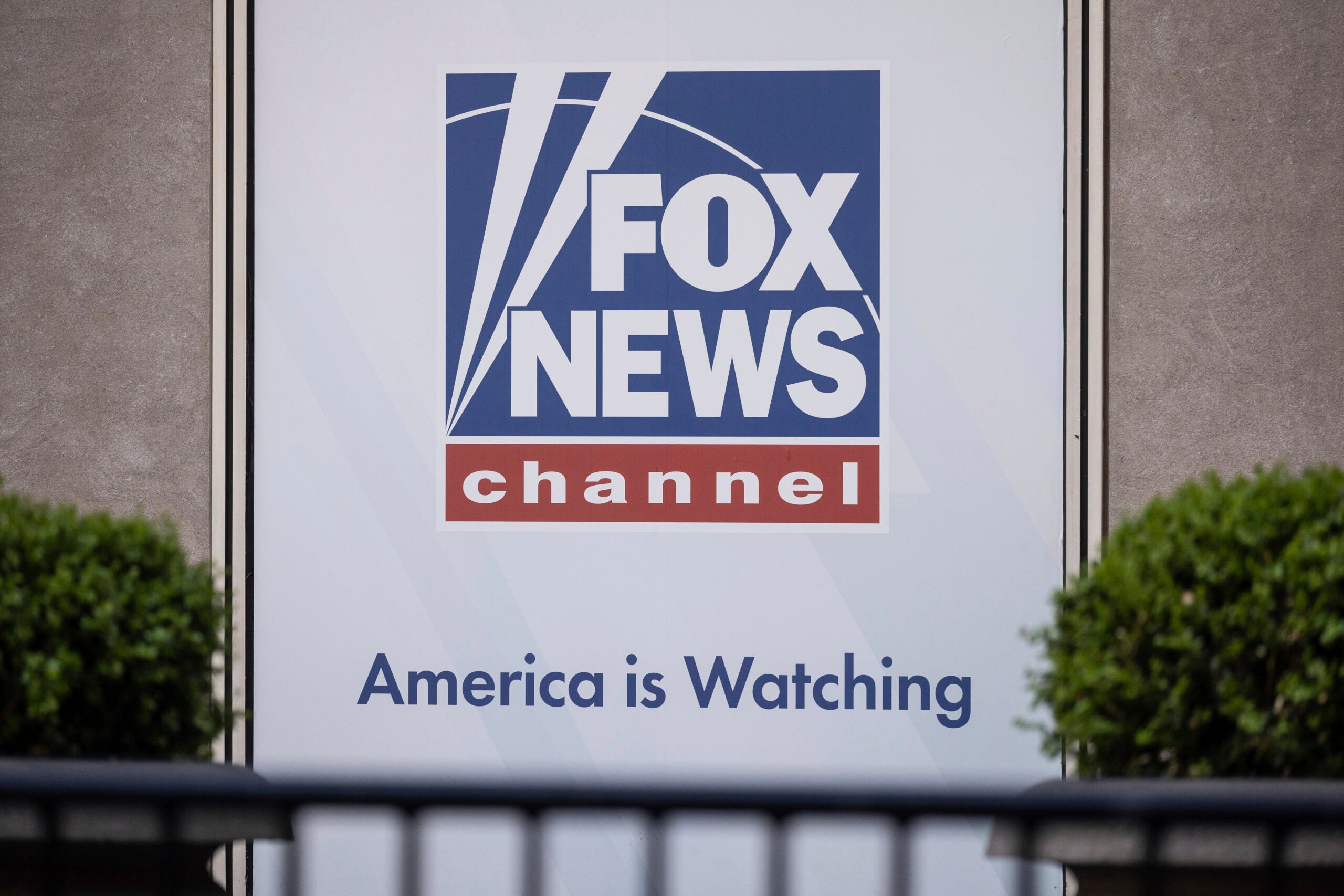 A logo of Fox News is displayed outside Fox News Headquarters in New York.