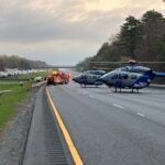 Medflights and other first responders help victims at the scene of a rollover crash on I-95 North in Byfield, Massachusetts.