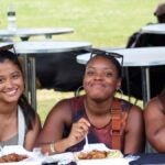 Three friends enjoy jerk at Boston Jerkfest