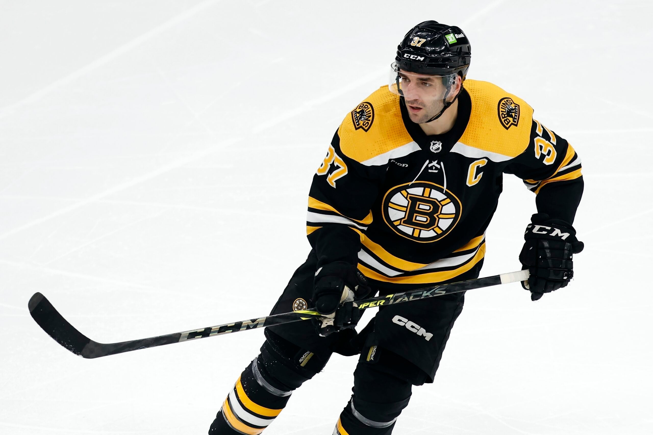 Boston Bruins' Patrice Bergeron plays against the Tampa Bay Lightning during the second period of an NHL hockey game, Saturday, March 25, 2023, in Boston. (AP Photo/Michael Dwyer)