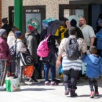 In Maine, asylum seekers are given instructions upon arriving at the Portland Expo Center.