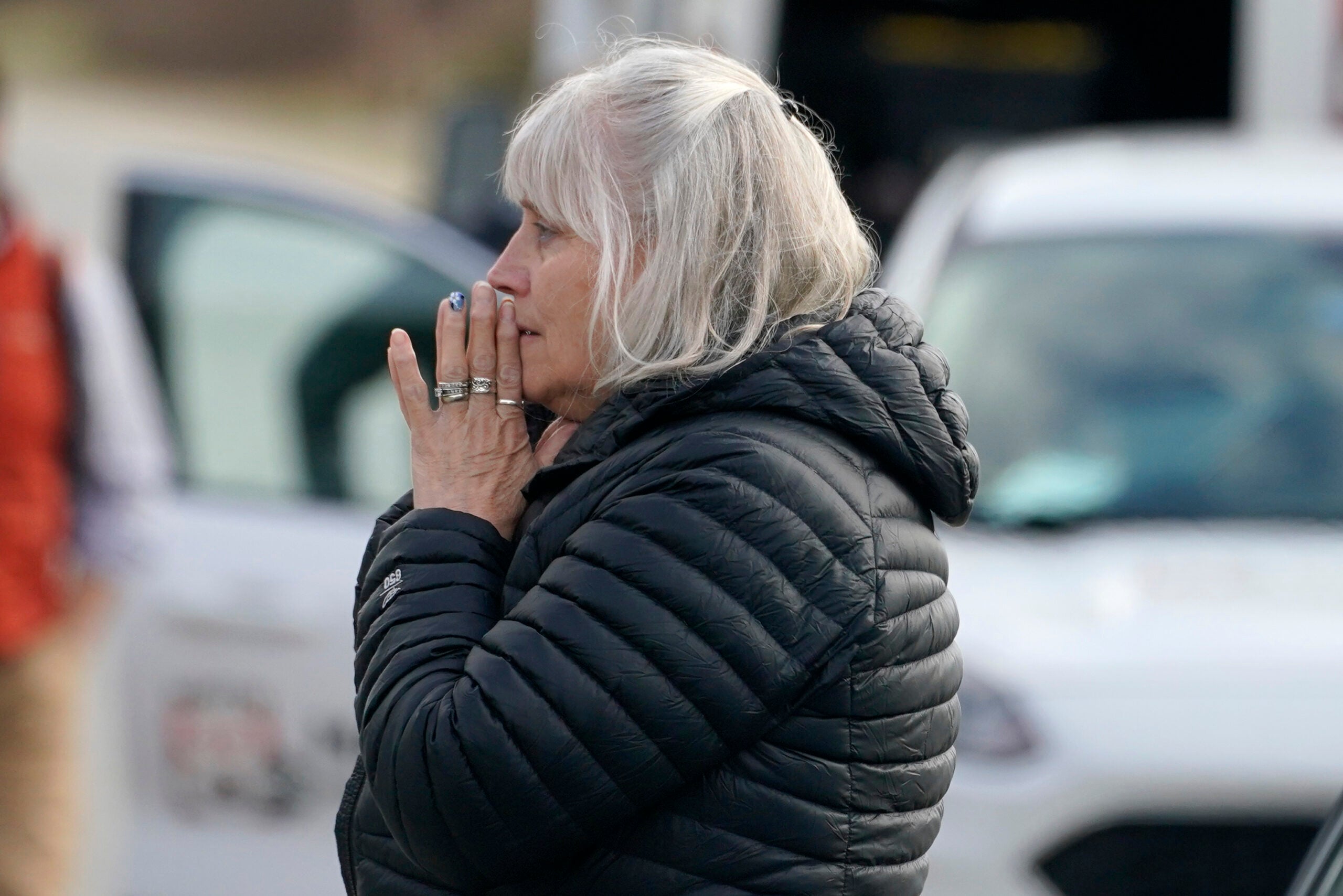 A woman reacts at the scene of a multiple shooting, Tuesday, April 18, 2023, in Bowdoin, Maine.
