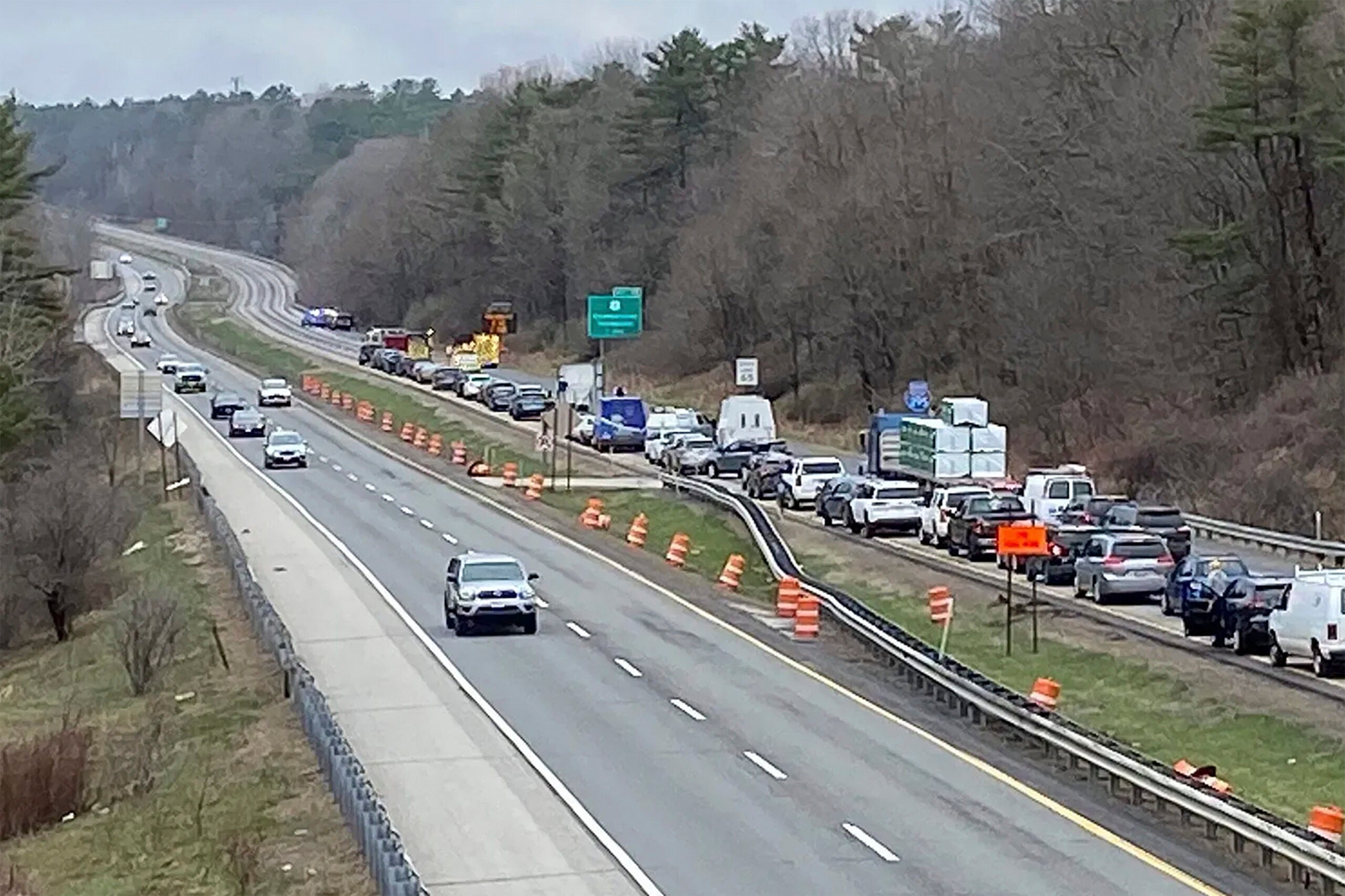 Traffic is backed up near the scene where people were injured in a shooting on Interstate 295, in Yarmouth, Maine, on Tuesday.