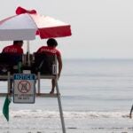 Lifeguards watch over Revere Beach, Saturday, Aug. 7, 2021.