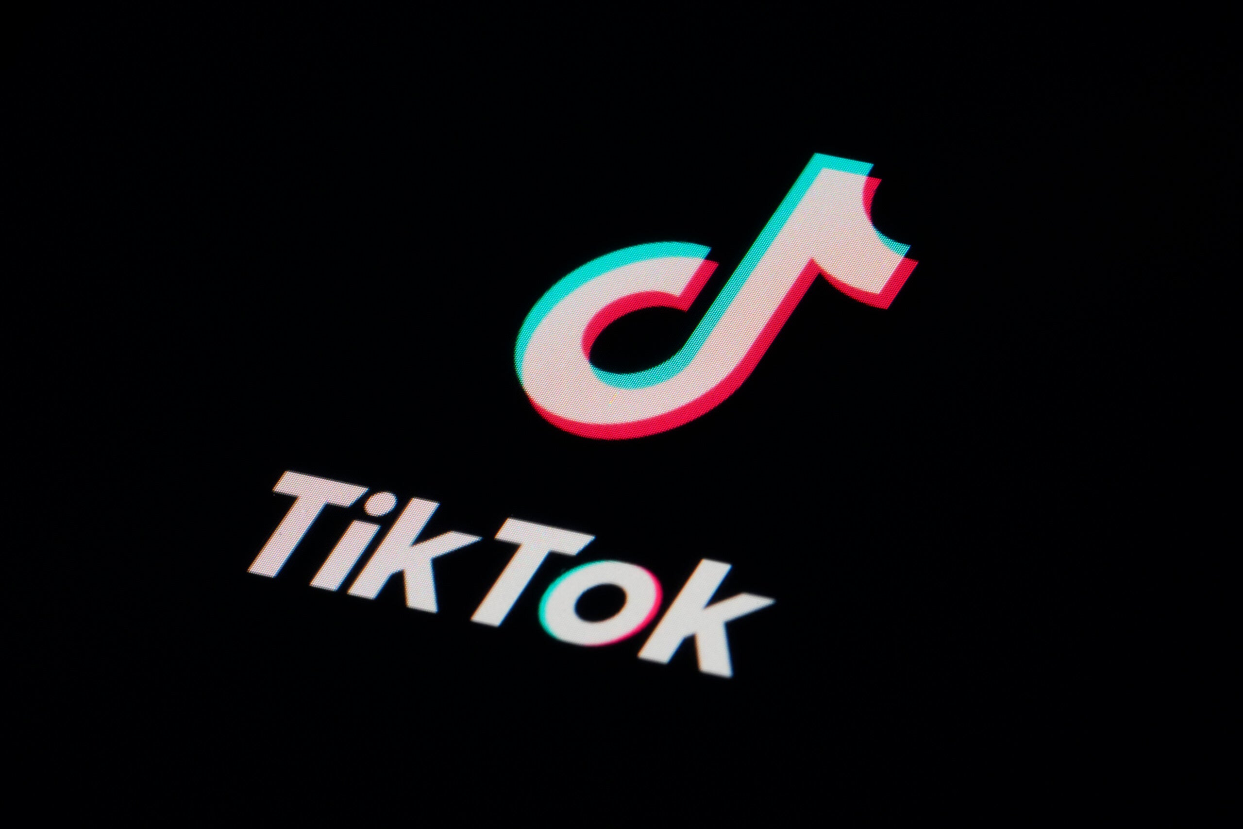 FILE - The icon for the video sharing TikTok app is seen on a smartphone.