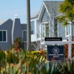 A home with a sale pending sign is used to illustrate a story on mortgage rates.