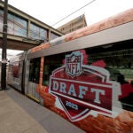 Signs for the 2023 NFL Draft appear all around Kansas City.