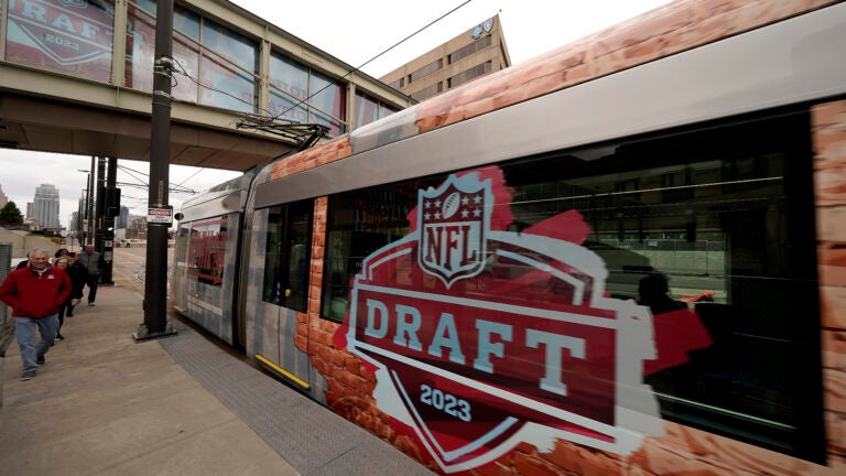 Signs for the 2023 NFL Draft appear all around Kansas City.