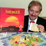 Klaus Teuber, a dental technician from Darmstadt, presents his game "The Settlers of Catan," Friday, Sept. 29, 1995, in Frankfurt, Germany.