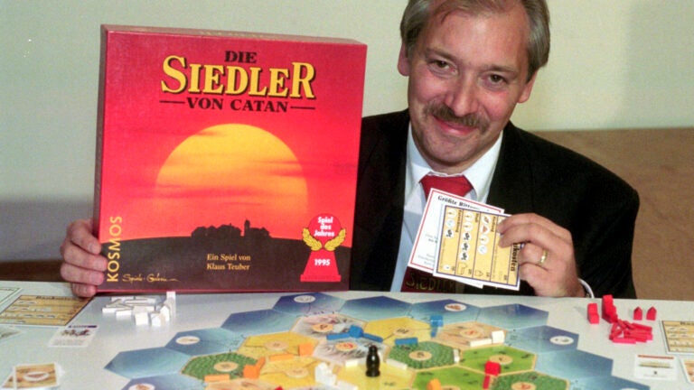 Klaus Teuber, a dental technician from Darmstadt, presents his game "The Settlers of Catan," Friday, Sept. 29, 1995, in Frankfurt, Germany.