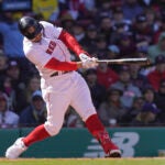 Boston Red Sox Adam Duvall hits a two-run single