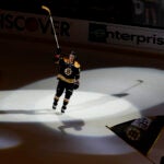 Boston Bruins' Tyler Bertuzzi acknowledges the cheers after being named one of the stars of the game after their 3-1 win over the Florida Panthers in Game 1 of an NHL hockey playoff series Monday, April 17, 2023, in Boston.