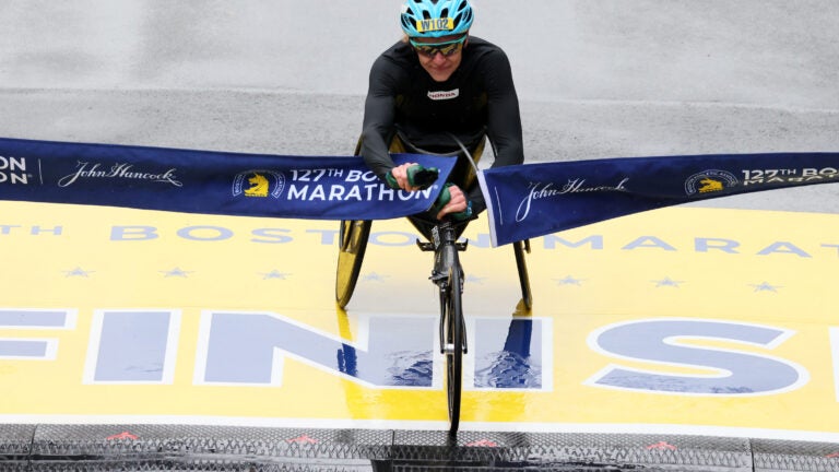 Susannah Scaroni crosses the finish line to win the women’s wheelchair race at the 2023 Boston Marathon.