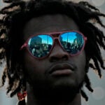 A man listens to a speaker at a rally to support Ralph Yarl, Tuesday, April 18, 2023, in Kansas City, Mo.