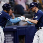 Red Sox -- Rays' Brandon Lowe, right, celebrates with Wander Franco