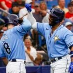 Tampa Bay Rays' Brandon Lowe and Yandy Diaz celebrate a solo home run.