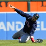 Boston Red Sox center fielder Adam Duvall attempts to catch a Detroit Tigers' Spencer Torkelson fly ball in the ninth inning of a baseball game in Detroit, Sunday, April 9, 2023. Duvall was injured on the play and left the game.