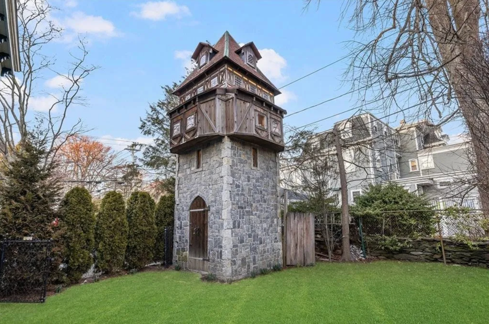 The house has a three-story watchtower in its backyard.