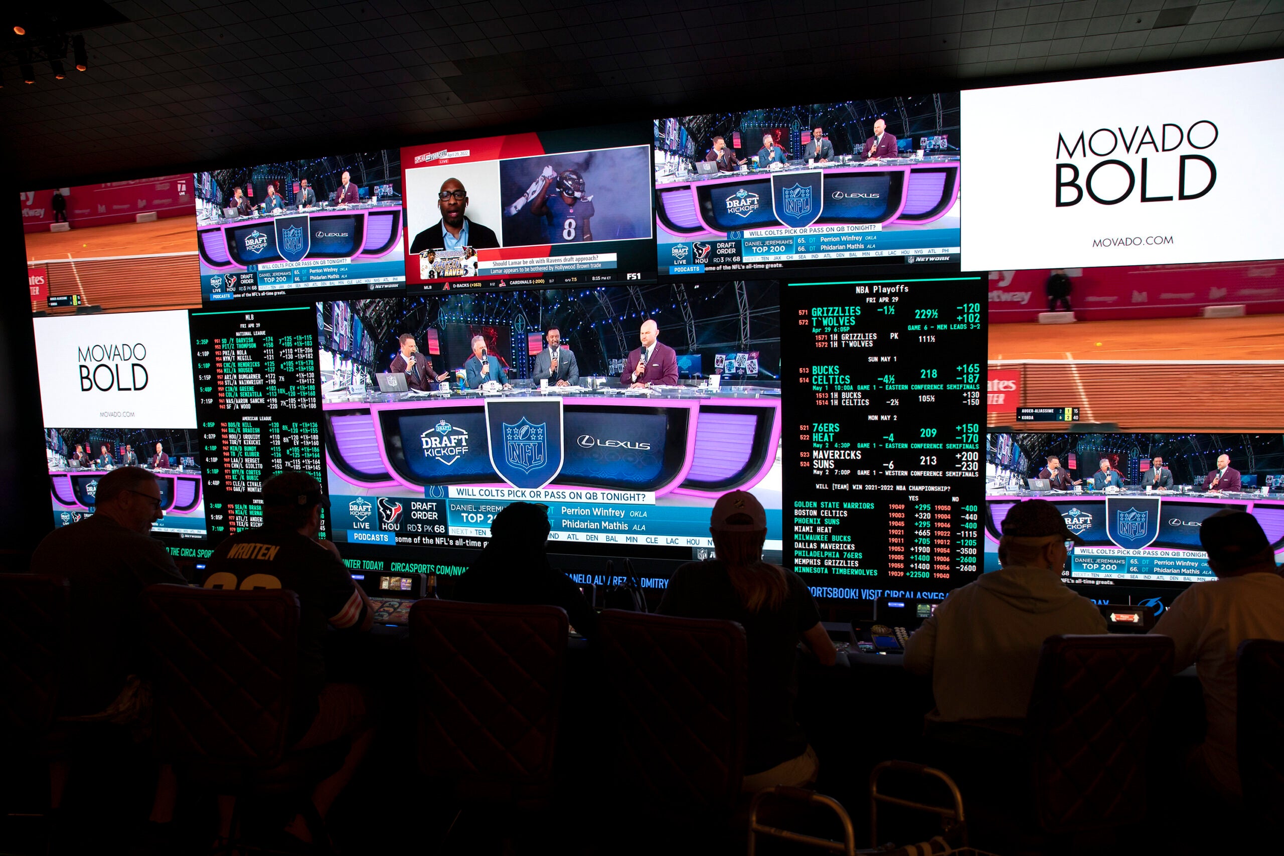 alt = NFL football draft coverage plays in the sportsbook at Circa in Las Vegas.