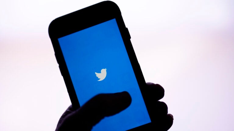 The Twitter application is seen on a digital device