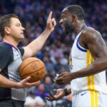 Draymond Green argues with an official.