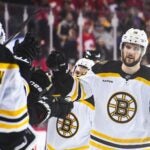 FEBRUARY 28: Pavel Zacha #18 of the Boston Bruins celebrates with his team after scoring in the third period forcing overtime against the Calgary Flames during an NHL game at Scotiabank Saddledome on February 28, 2023 in Calgary, Alberta, Canada.