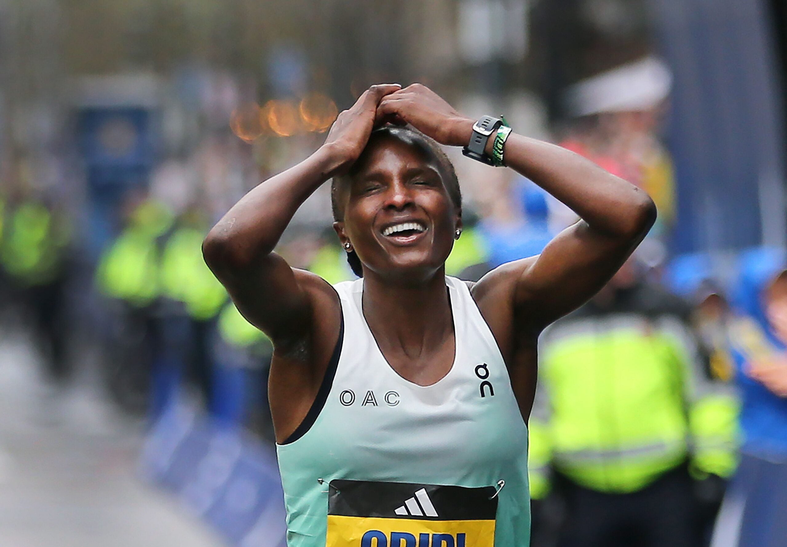 Women’s winner Hellen Obiri crosses the finish line at the 2023 Boston Marathon.