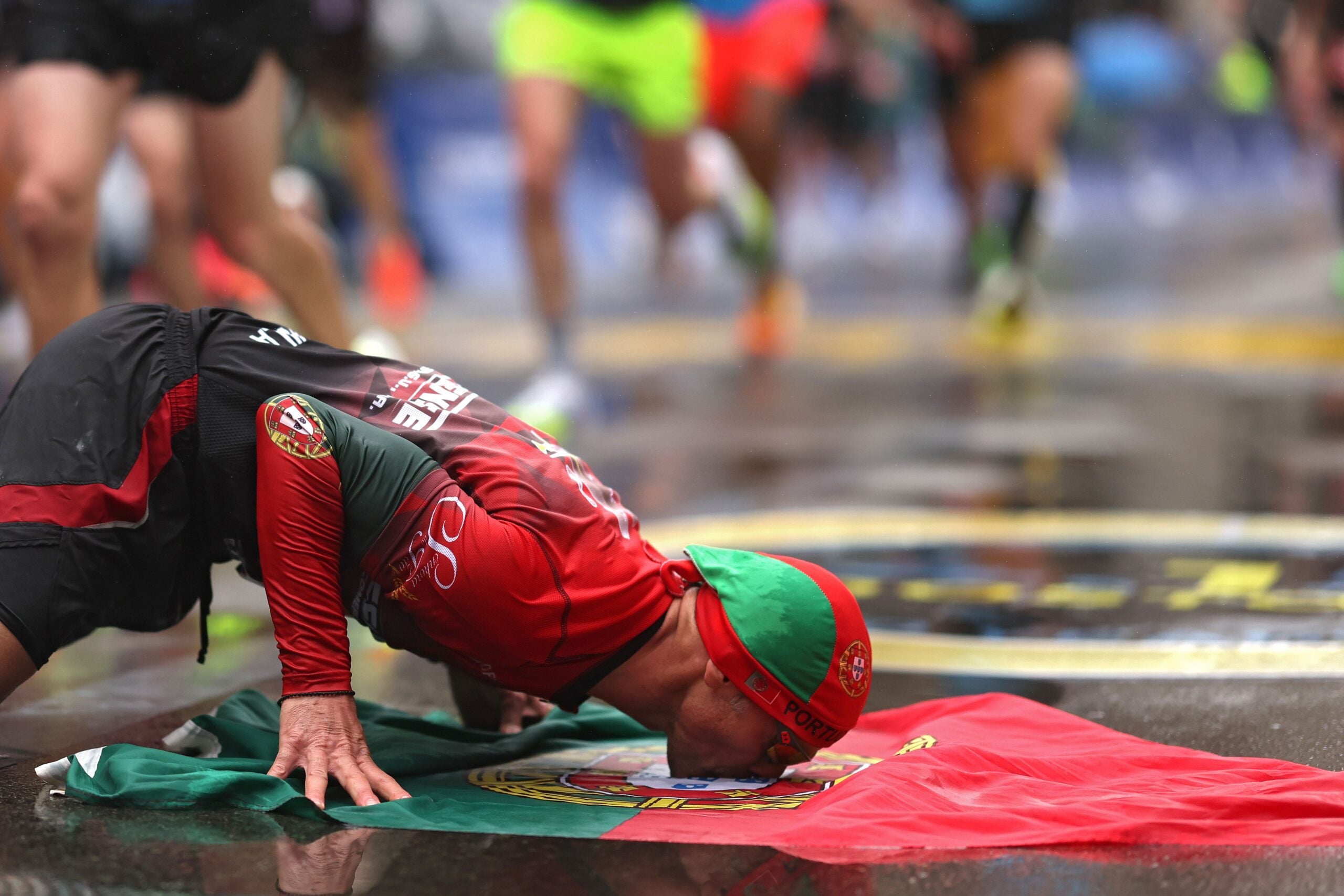 Manuel Cabral celebrates after crossing the finish line during the 127th Boston Marathon on April 17, 2023 in Boston, Massachusetts.