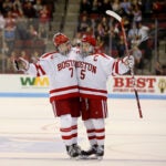 Charlie McAvoy (7) (cq) and Matt Grzelcyk (5) (cq) celebrate Grzelcyk's goal during the first period of the Boston University's hockey game against Northeastern University at Agganis Arena in Boston, MA on November 06, 2015.