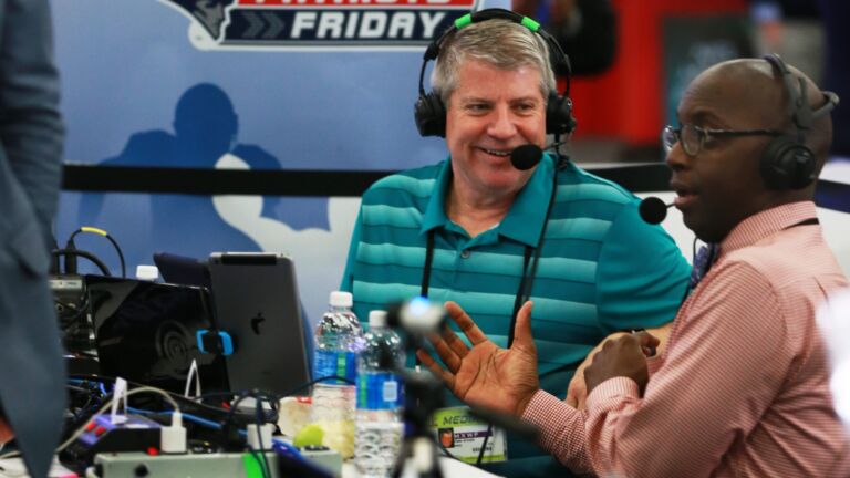 Dale Arnold (left) and Michael Holley (right) co-hosts of the Dale & Holley Show are pictured as they do their show on "Radio Row" in the Media Center at the Super Bowl.