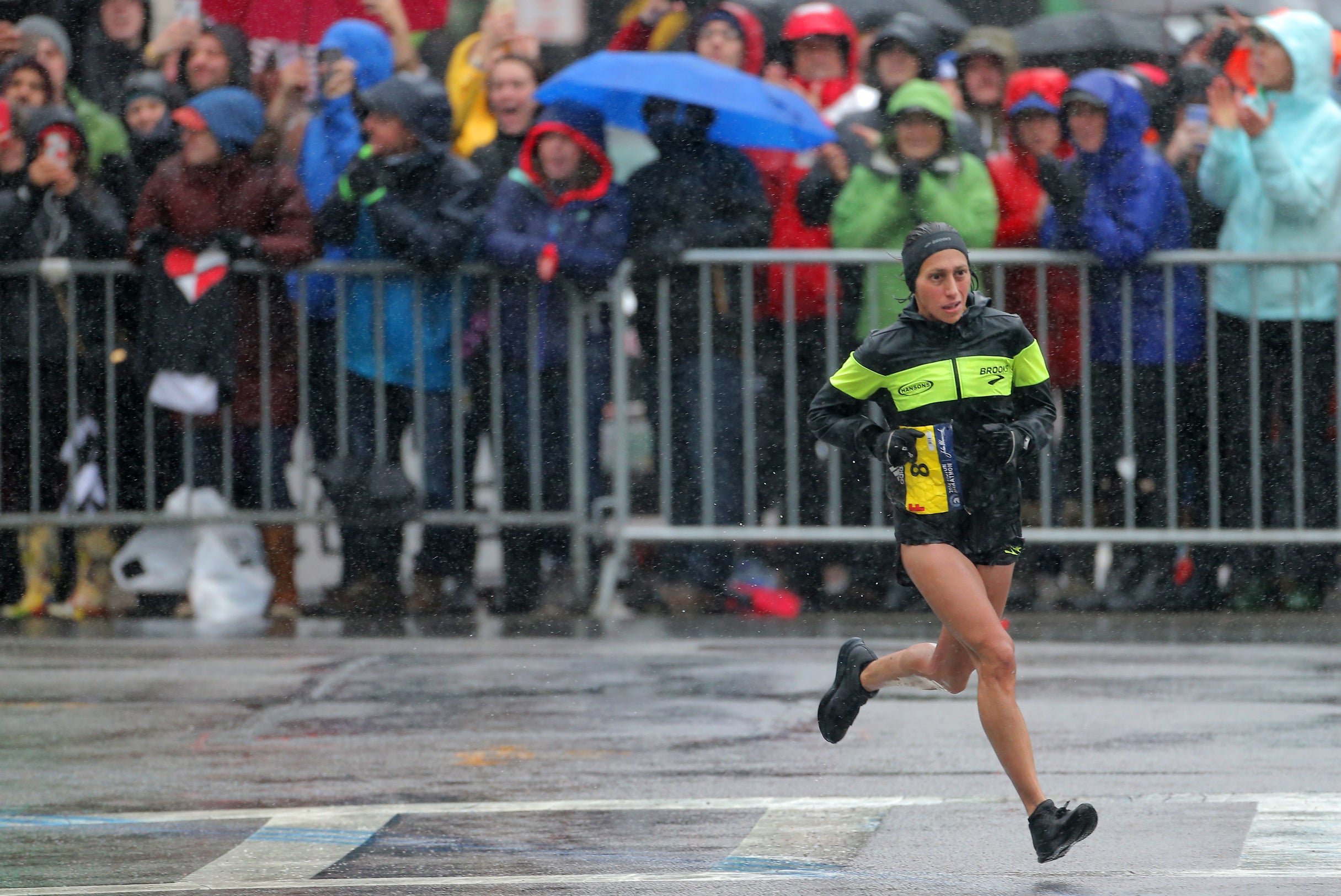 Des Linden enters the final stretch of the 2018 Boston Marathon.