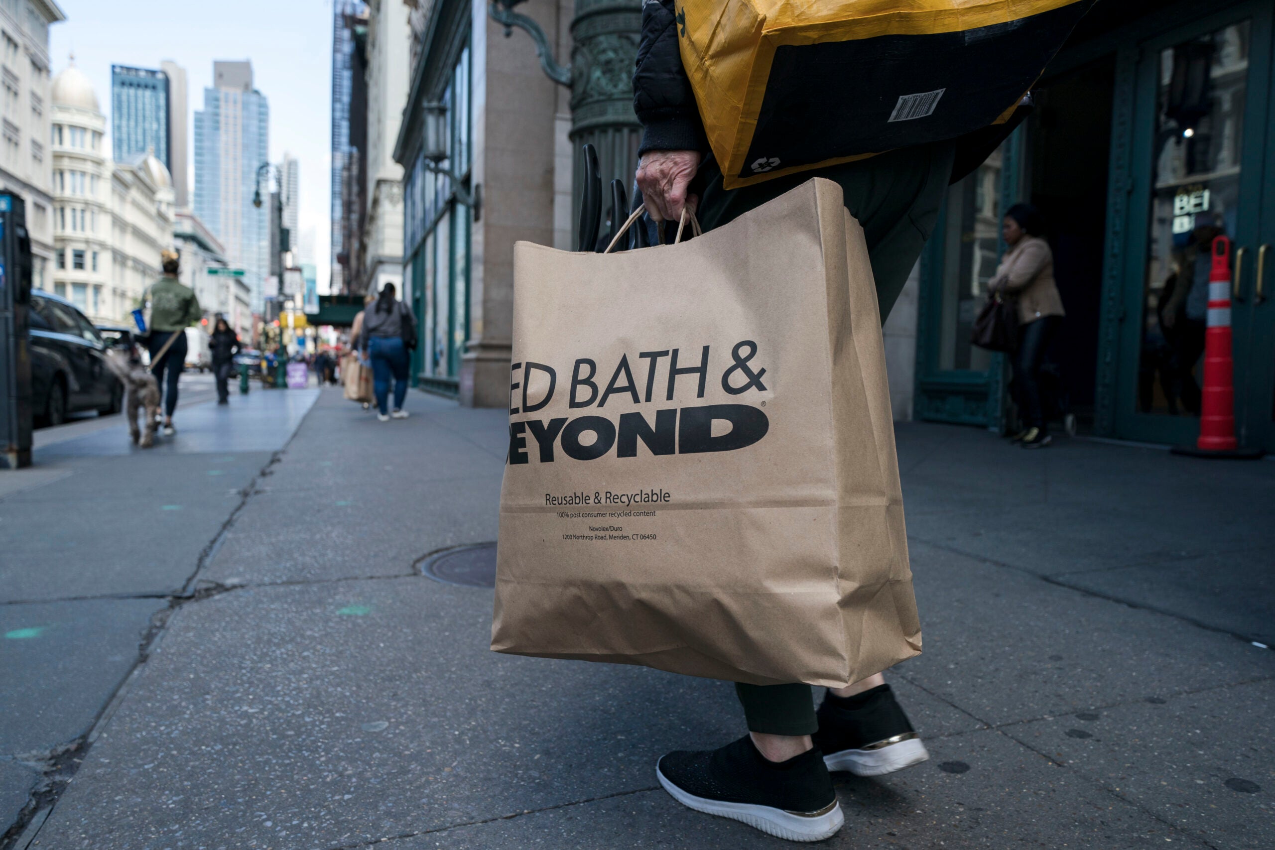 A shopper carries a Bed Bath & Beyond bag outside the company’s store in the Chelsea neighborhood of New York.