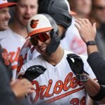 Ramon Urias #29 of the Baltimore Orioles celebrates with teammates after scoring during the eighth inning against the Boston Red Sox.