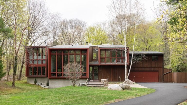 3 Barberry Road, a mid-century modern home with vertical lines and walls of glass.