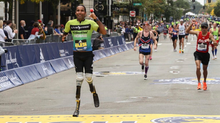 Rajesh Durbal crosses the finish line in the 125th Boston Marathon.