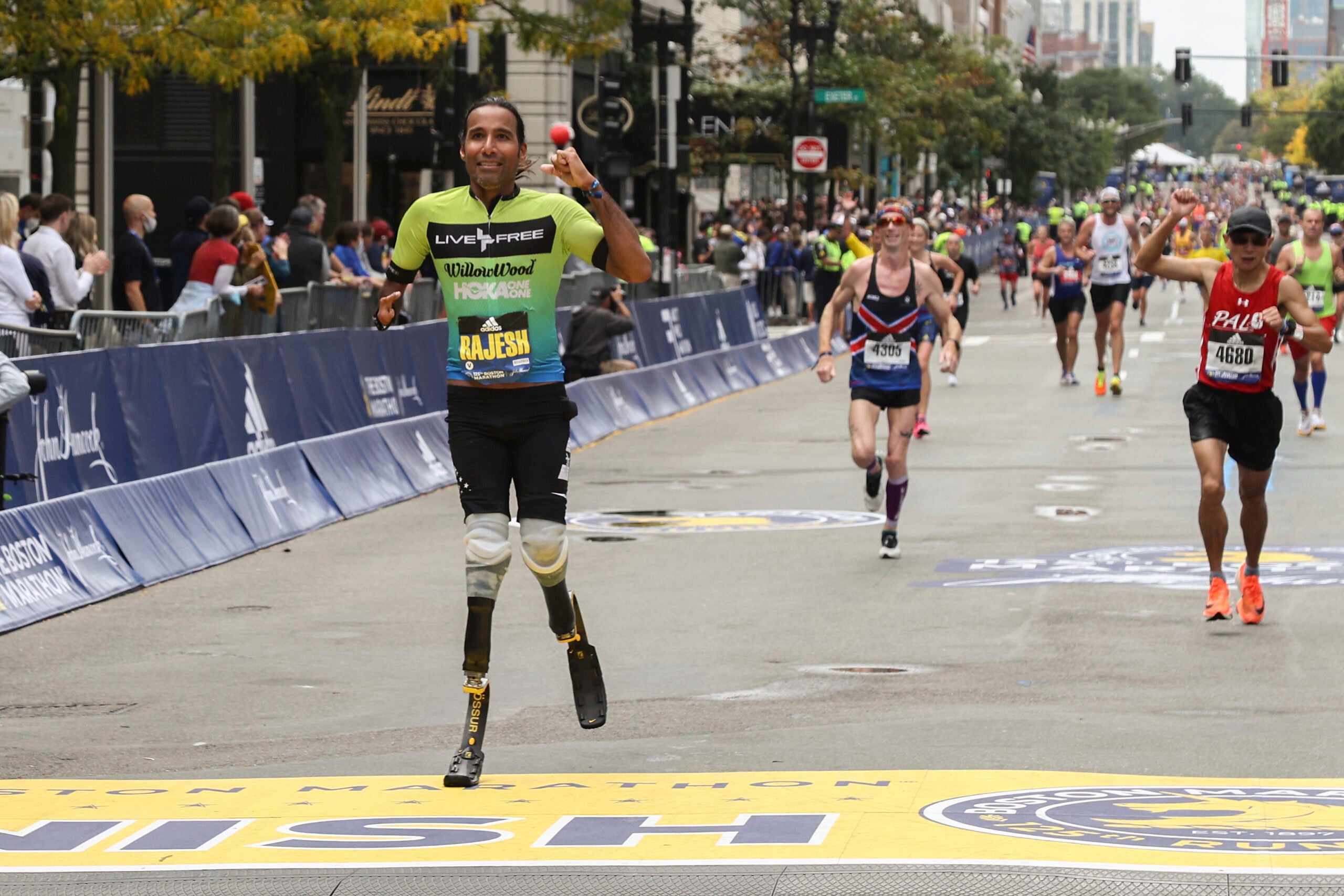 Rajesh Durbal crosses the finish line in the 125th Boston Marathon.