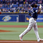 Randy Arozarena of the Tampa Bay Rays celebrates after hitting a three run home run.
