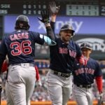Adam Duvall of the Red Sox celebrates his sixth inning three run home run against the Tigers.