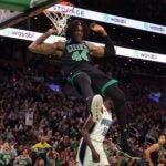 Celtics center Rob Williams throws down a dunk against the Magic.